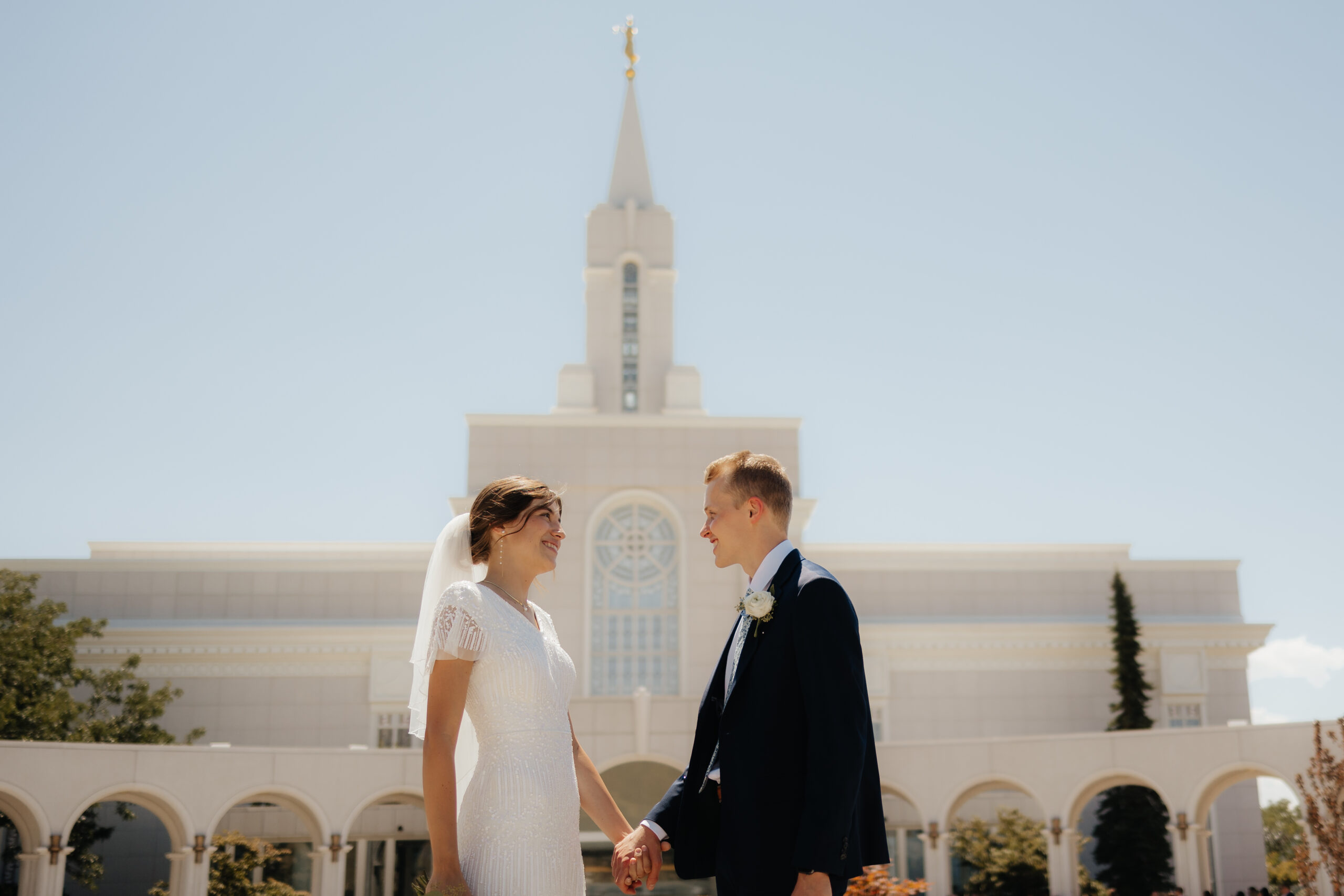 Bride and groom at the Bountiful temple at their wedding day